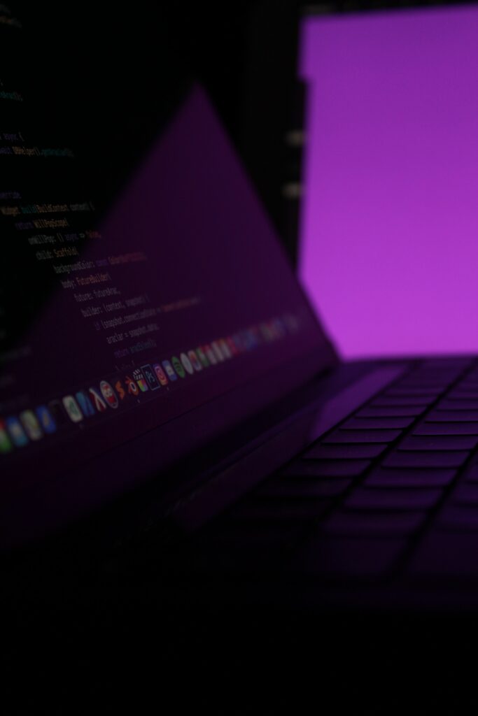 Dim Glow Laptop Keyboard Wallpaper for Tech Enthusiasts