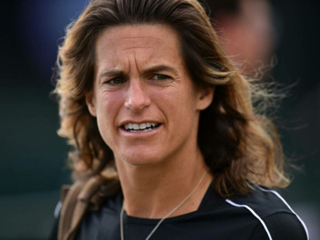 Amélie Mauresmo focused during intense tennis match dynamic wallpaper background