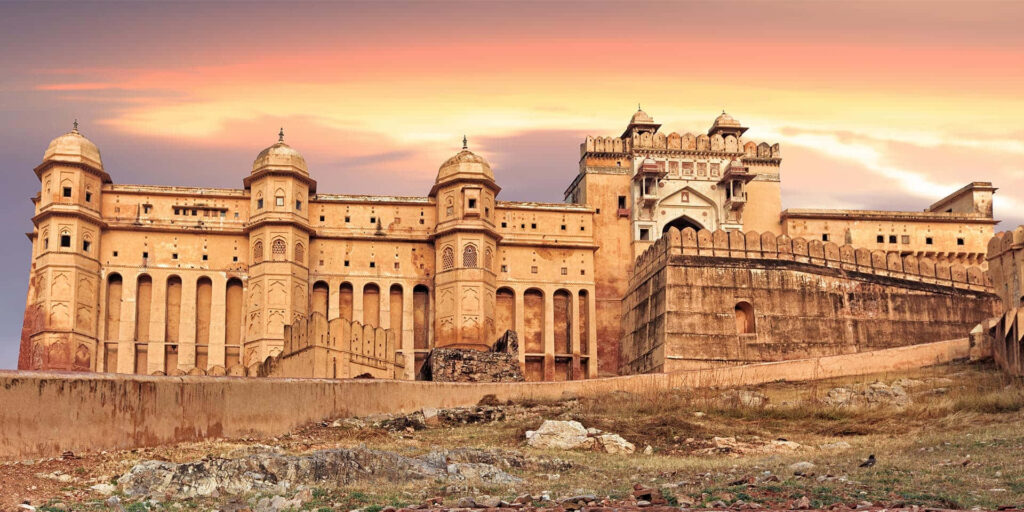 Amer Fort at sunset showcasing majestic architecture and historic charm wallpaper background