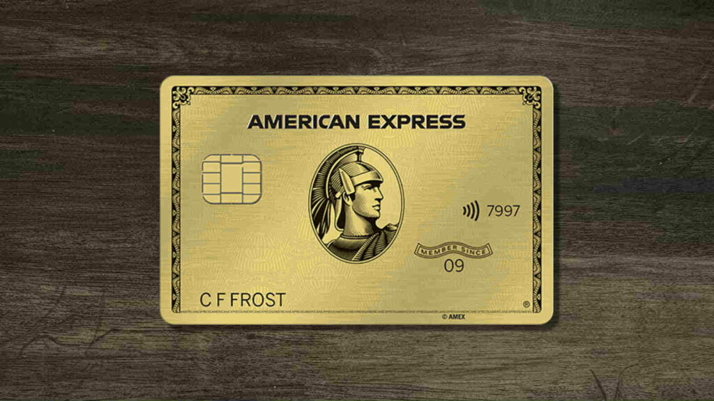 American Express Gold Card on textured wood background highlighting classic gold design wallpaper