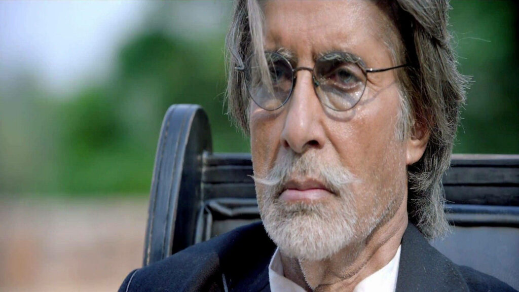 Close-up of Amitabh Bachchan as Wazir with intense look round glasses salt and pepper beard Wallpaper