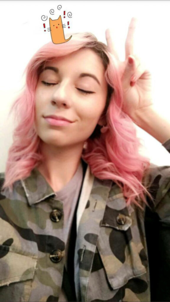 Amy Nelson wallpaper with soft pink hair camouflage jacket eyes closed peace sign cartoon cat doodle