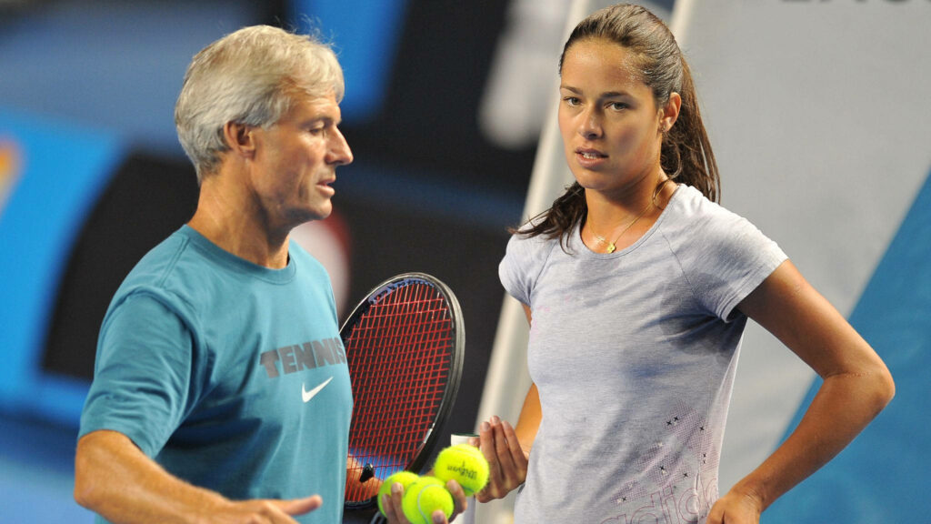 Ana Ivanovic focused tennis practice with coach on court detailed wallpaper background