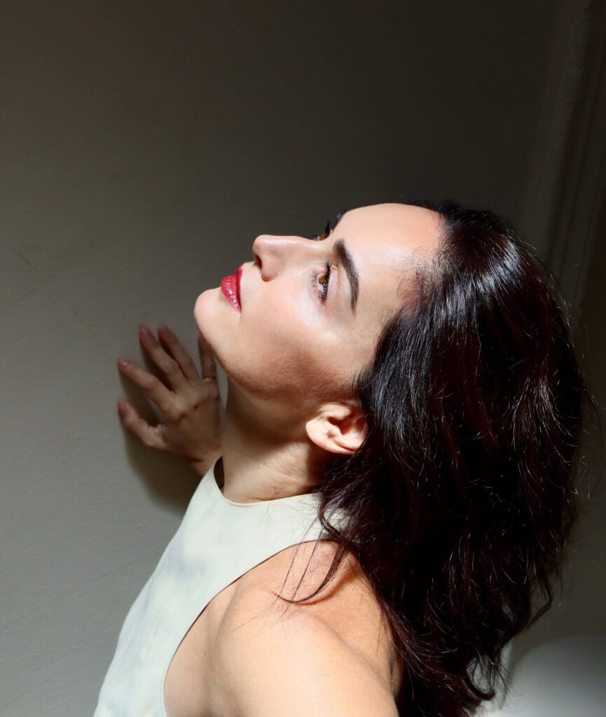 Ana de la Reguera elegant profile portrait with soft lighting high resolution wallpaper background