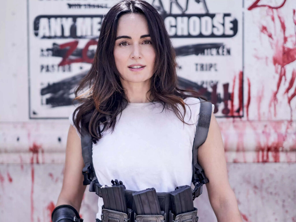 Ana de la Reguera in tactical outfit with bold striking wallpaper background for stylish decor