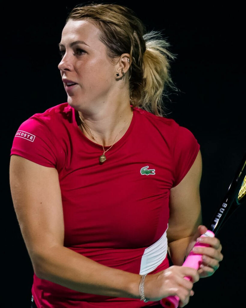 Anastasia Pavlyuchenkova focused tennis player gripping racket during intense match wallpaper background