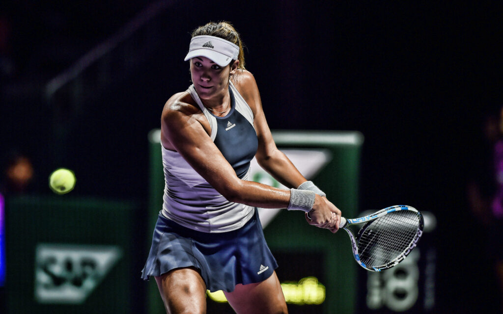 Anastasija Sevastova focused tennis player returning shot fierce competitive match wallpaper background