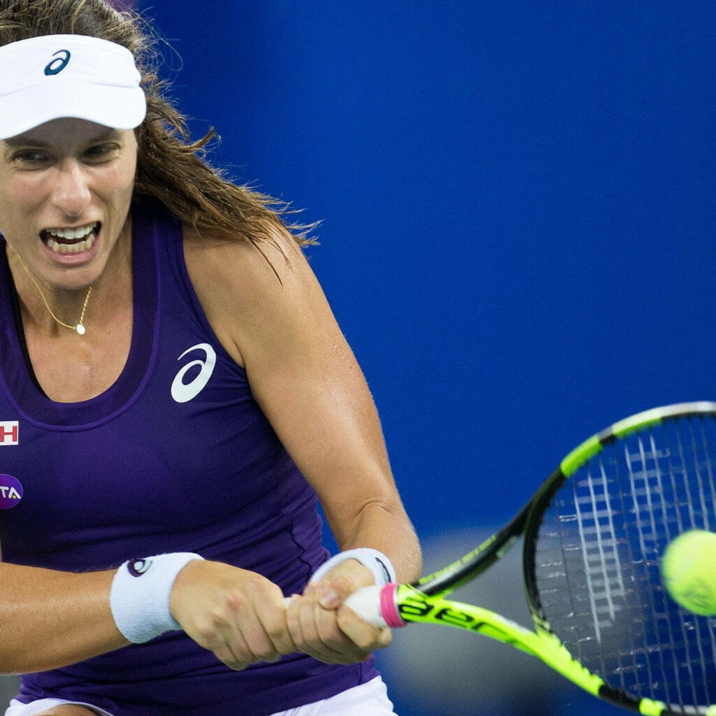 Anastasija Sevastova hitting powerful backhand with intense focus in tennis match wallpaper