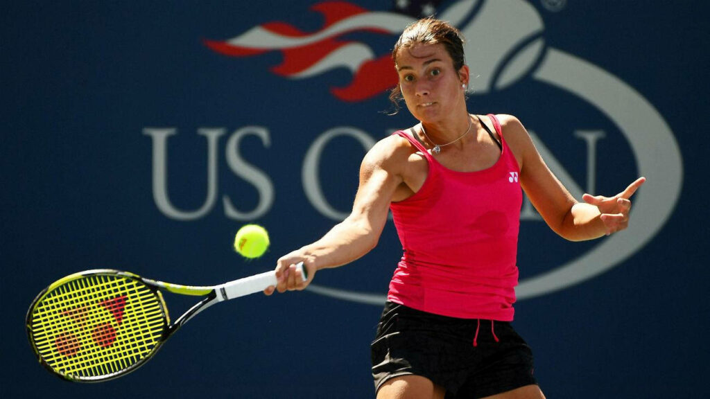 Anastasija Sevastova hitting a powerful forehand during intense US Open tennis match wallpaper