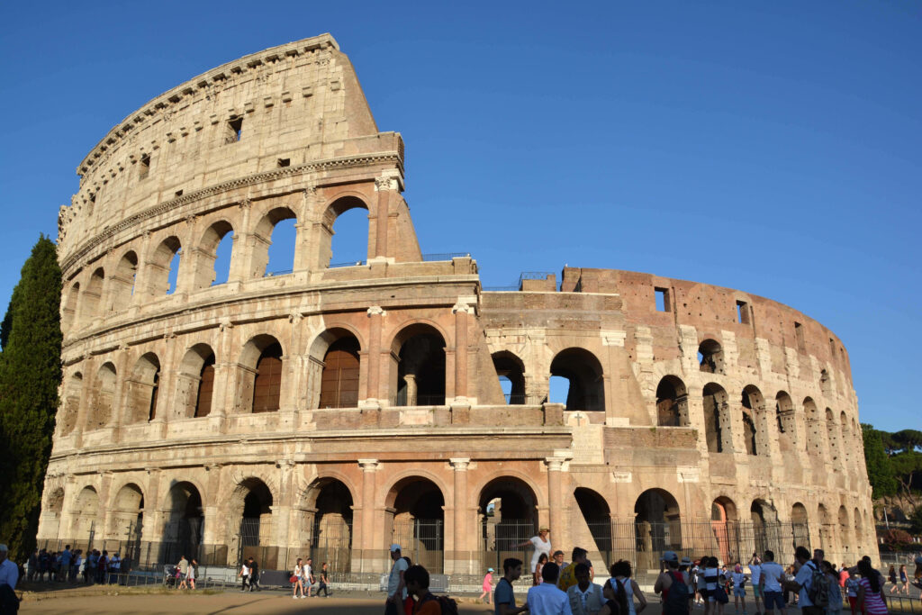 Ancient Roman Colosseum wallpaper showing historic arches and stone textures in natural daylight