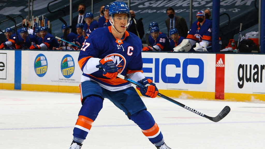 Anders Lee number 27 New York Islanders focused mid-play against Chicago Blackhawks on ice Wallpaper