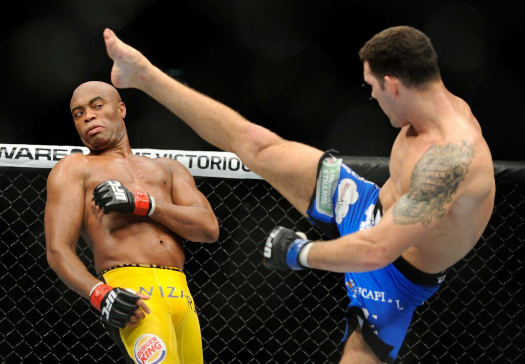 Anderson Silva expertly dodges opponent's kick inside UFC octagon showing top reflexes Wallpaper