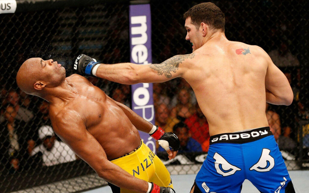 Anderson Silva dodges punch showcasing UFC signature defensive skill in the octagon wallpaper