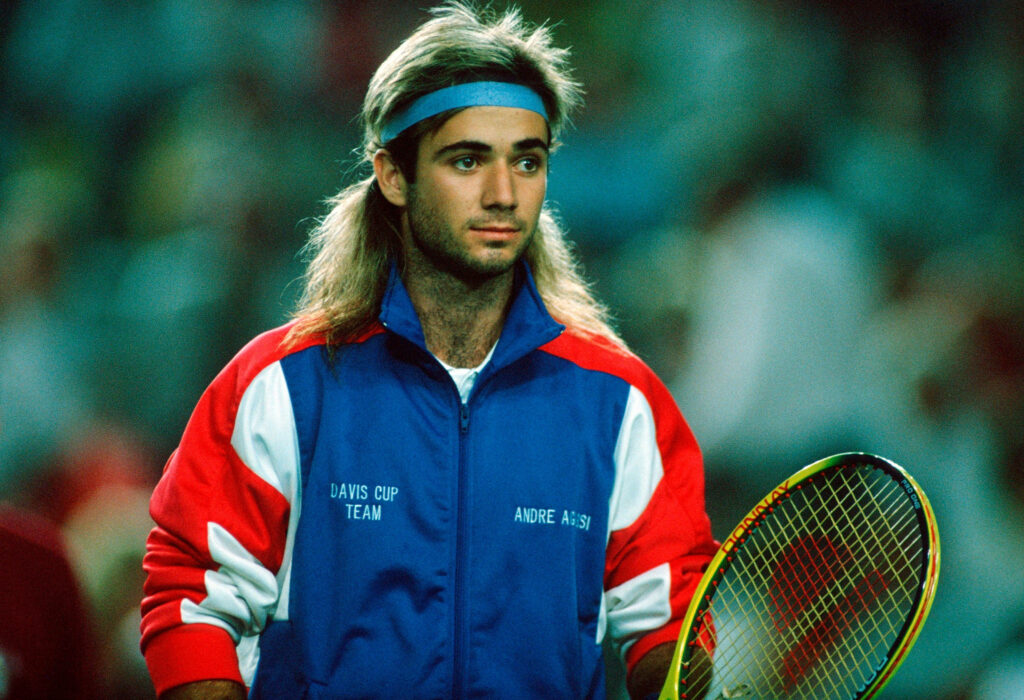 Andre Agassi: Iconic Style in Blue Headband & Colorful Jacket Wallpaper
