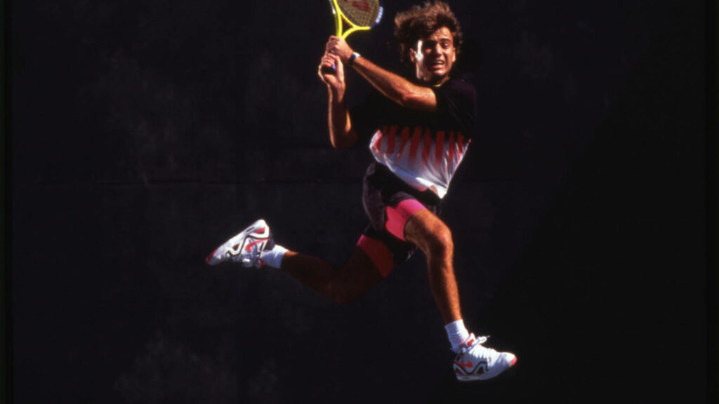 Dynamic Andre Agassi Wallpaper: Tennis Action in Nike Apparel