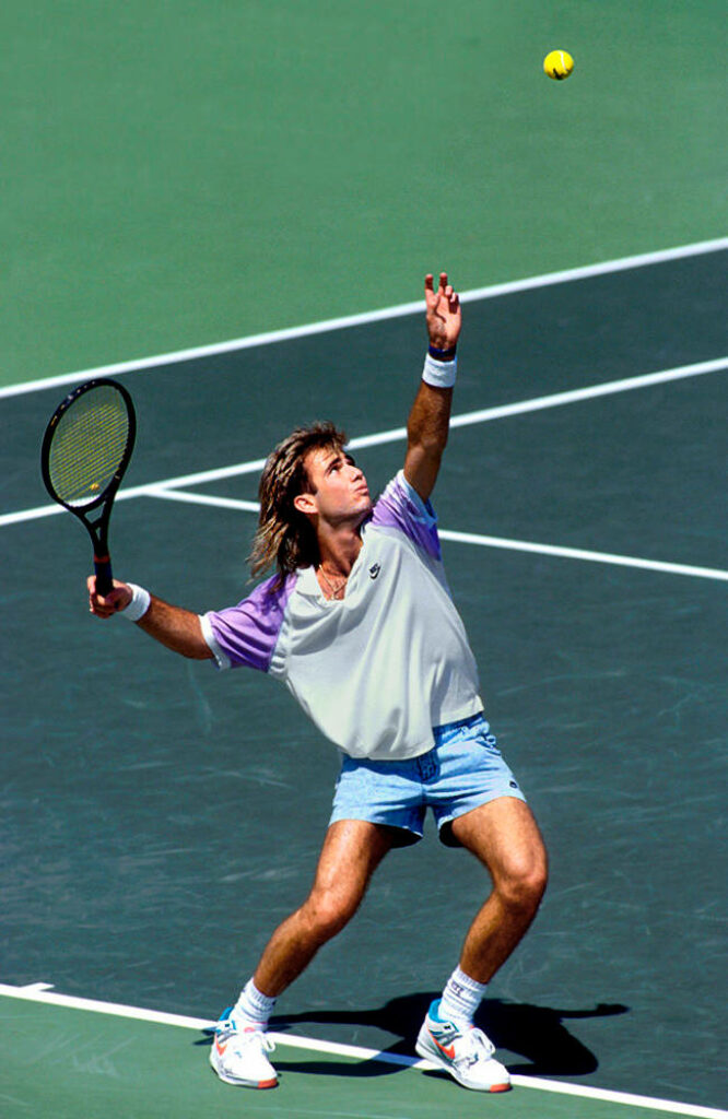 Andre Agassi in Action: Tennis Court Wallpaper Background