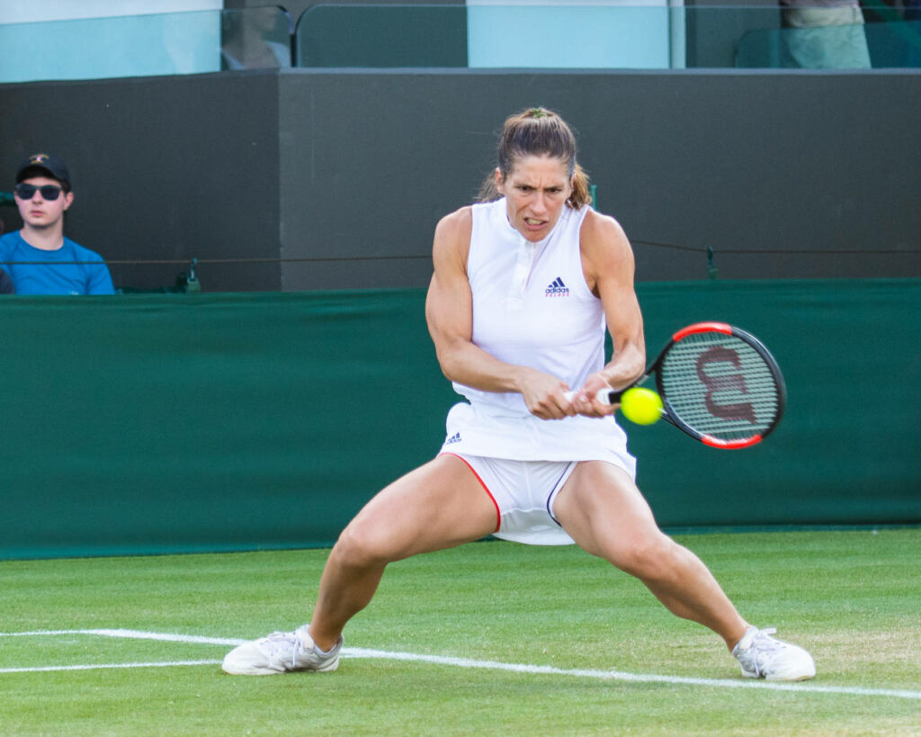 Andrea Petkovic hitting focused backhand on Wimbledon 2016 grass courts tennis match wallpaper