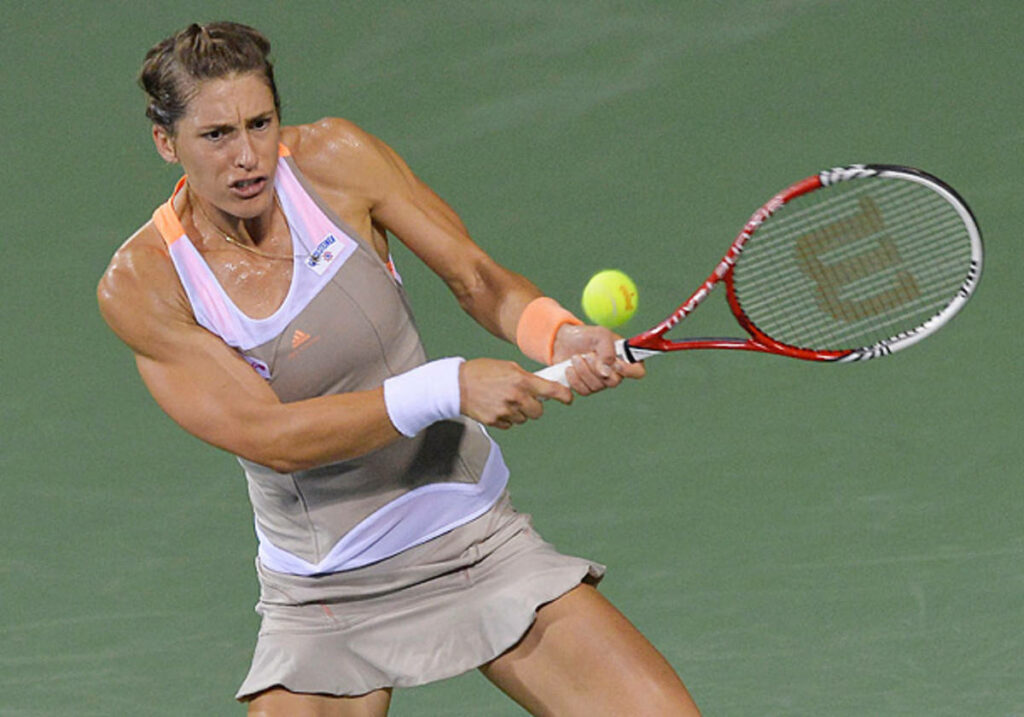 Andrea Petkovic intense tennis shot return showcasing athleticism and determination on court Wallpaper