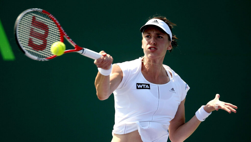Professional tennis player Andrea Petkovic focused in action during Wimbledon tournament match Wallpaper
