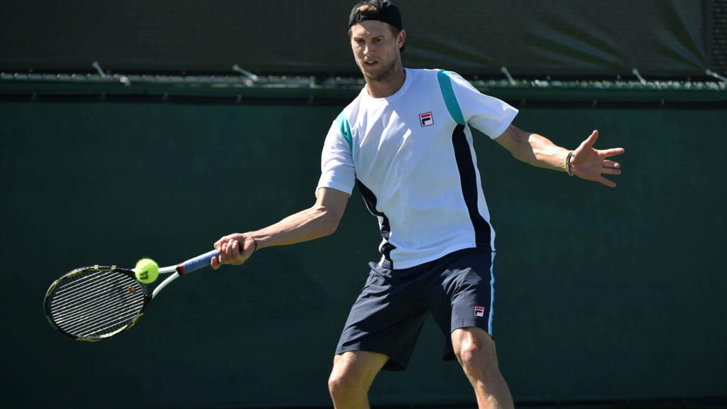 Andreas Seppi intense tennis player ready to receive ball on court action-packed wallpaper background