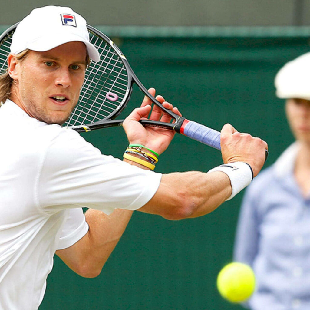 Andreas Seppi focused tennis player returning ball showcasing professional skills on court wallpaper
