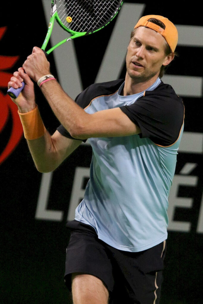 Andreas Seppi delivering a powerful tennis shot with intense focus in dynamic match action Wallpaper