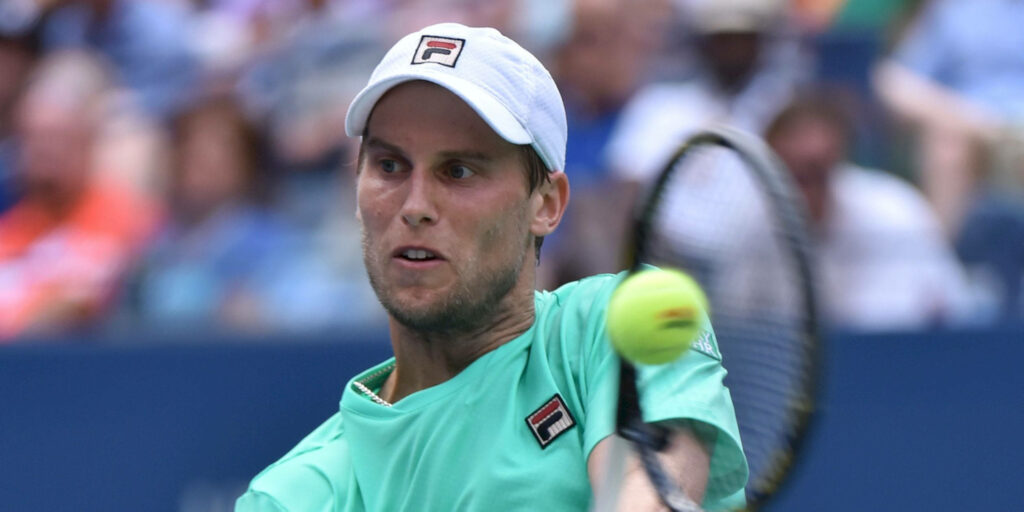 Andreas Seppi intense tennis action close-up preparing to smash ball during match wallpaper