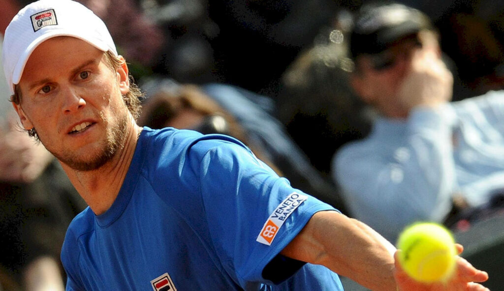 Andreas Seppi aiming his tennis shot with focus and determination during intense match play Wallpaper