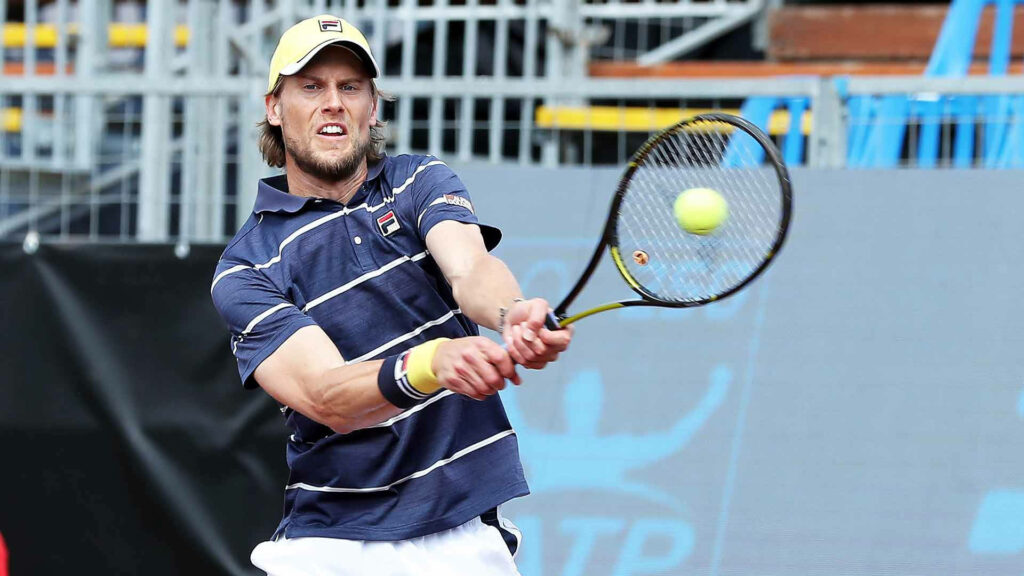 Andreas Seppi fiercely smashing tennis ball showing athleticism and competitive spirit on court Wallpaper
