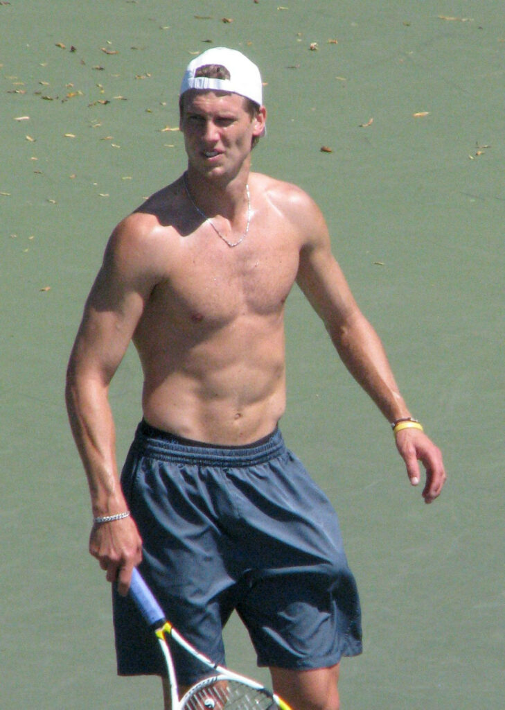 Andreas Seppi shirtless playing tennis showcasing athletic build and intense focus on court Wallpaper