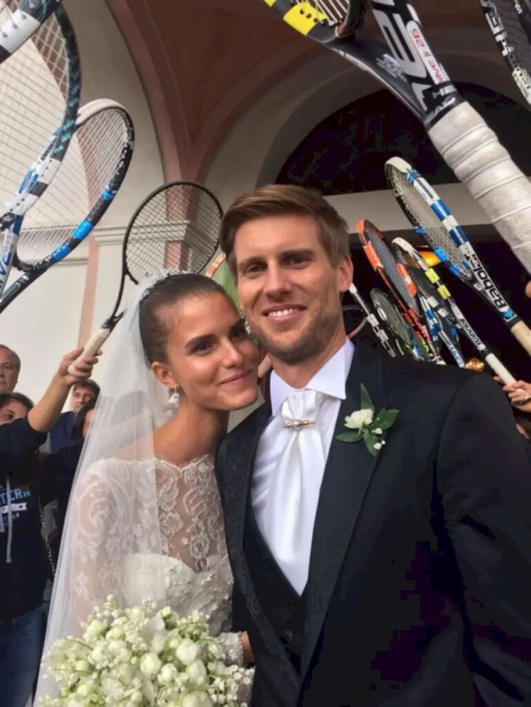 Andreas Seppi and wife joyful wedding celebration with tennis racquets friends elegant background Wallpaper