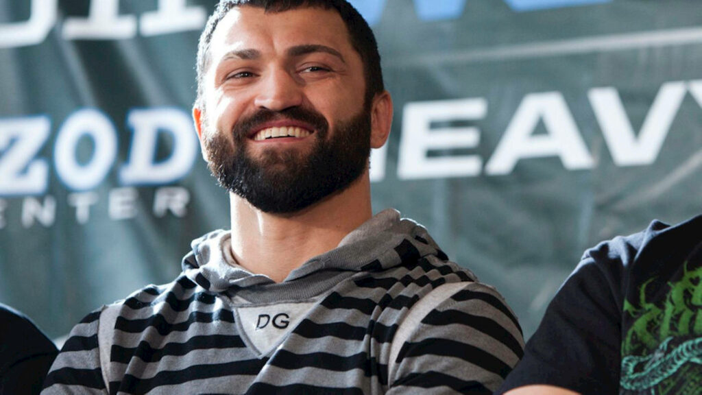 Andrei Arlovski smiling confidently in athletic style high quality wallpaper background image