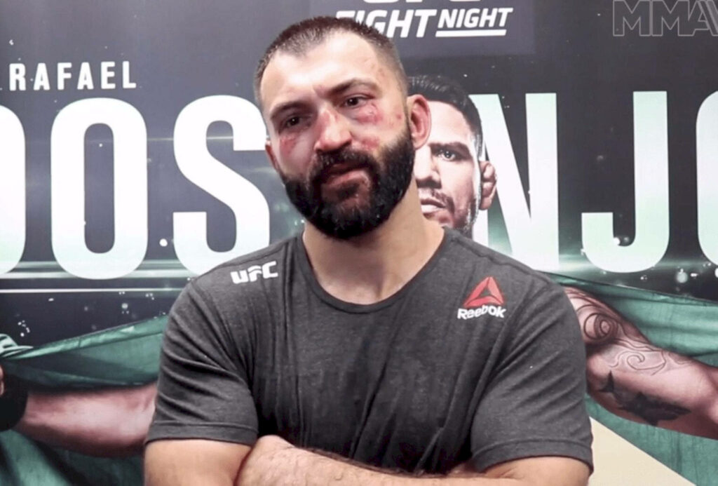 Andrei Arlovski UFC fighter with fight wounds in gear showing resilience on fight night wallpaper