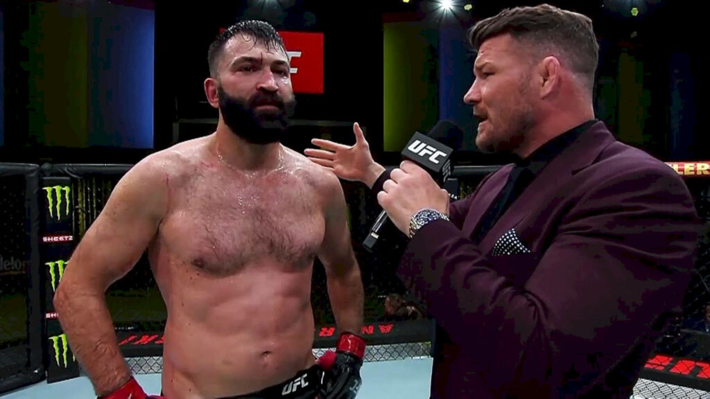 UFC fighter Andrei Arlovski in octagon post-fight interview showing determination and resilience Wallpaper