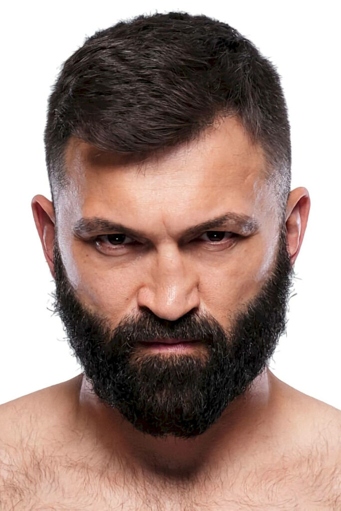 Portrait of Former UFC Heavyweight Champion Andrei Arlovski with intense determined expression Wallpaper