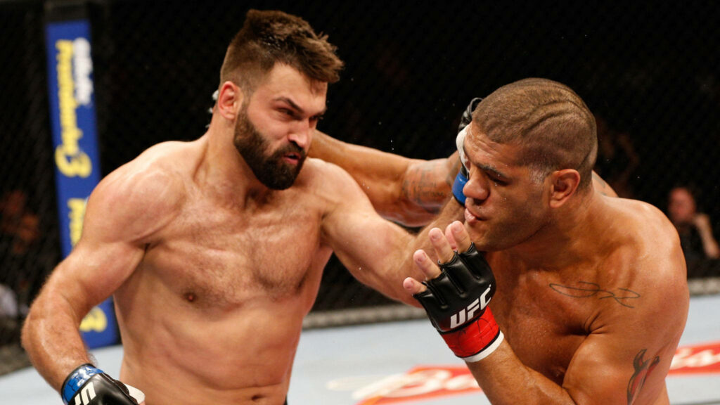 Belarusian American martial artists Andrei Arlovski and Antonio Silva intense UFC fight moment Wallpaper