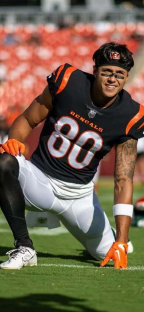 Andrei Iosivas warming up in Cincinnati Bengals uniform football field wallpaper background