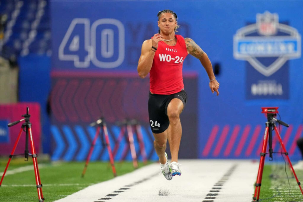 Andrei Iosivas sprinting powerfully at NFL Combine 40 yard dash showcasing athleticism and focus Wallpaper