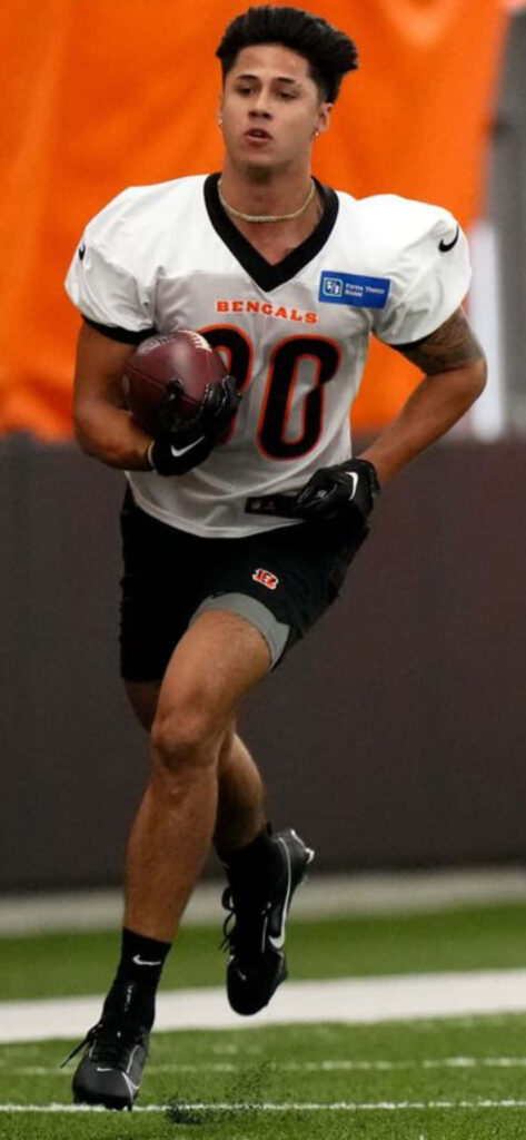 Andrei Iosivas focused running drill athleticism determination dynamic football wallpaper background