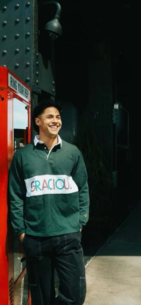 Andrei Iosivas smiling in green gracious sweater stylish cheerful wallpaper background