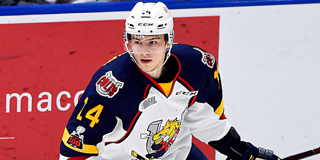 Andrei Svechnikov Barrie Colts hockey player skating fast during intense game action wallpaper