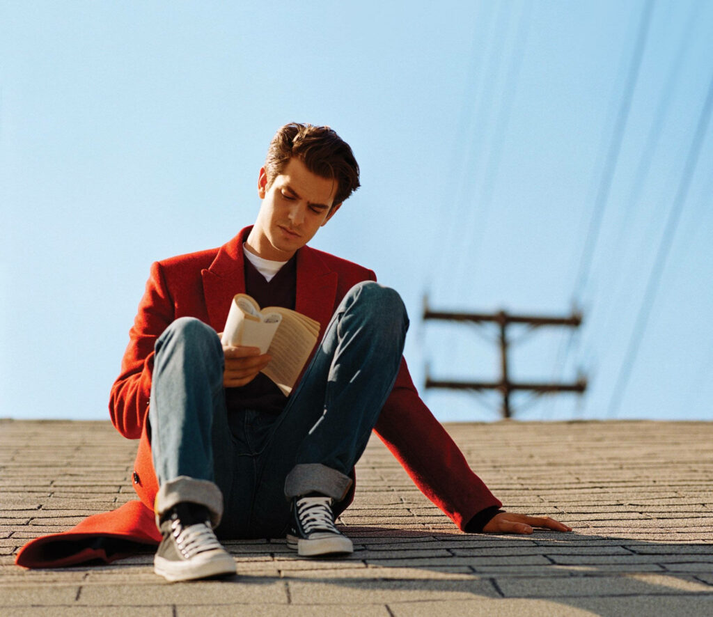 Andrew Garfield rooftop reading book in red coat and jeans stylish Vogue photoshoot wallpaper