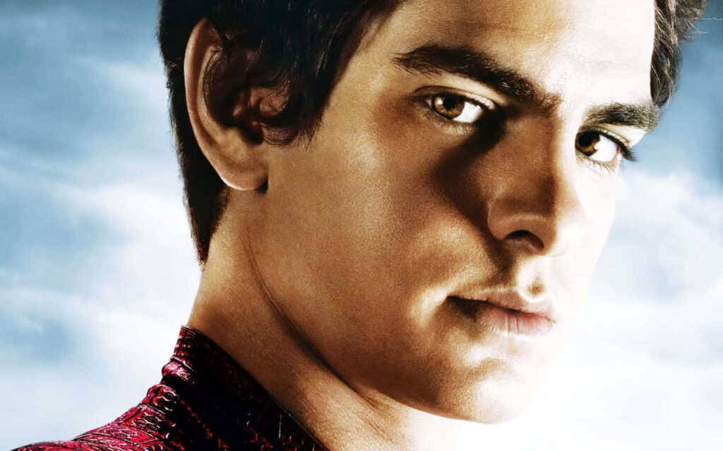 Close-up of Andrew Garfield in Spider-Man suit with determined expression and cloudy sky background Wallpaper