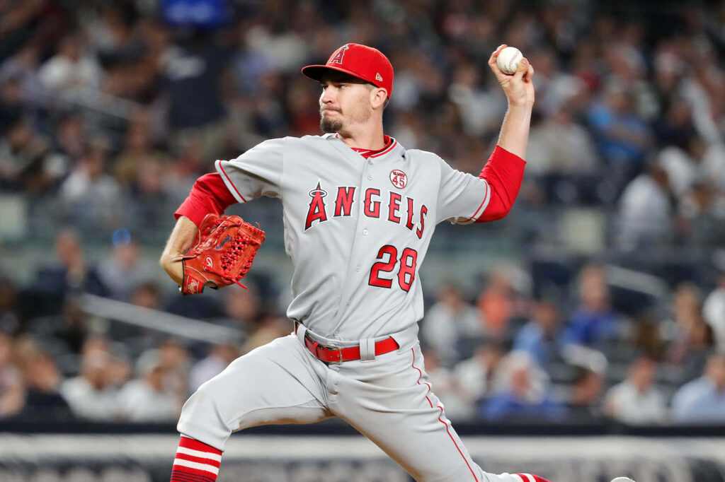 Andrew Heaney Angels pitcher mid-pitch intense focus athleticism baseball field action shot Wallpaper