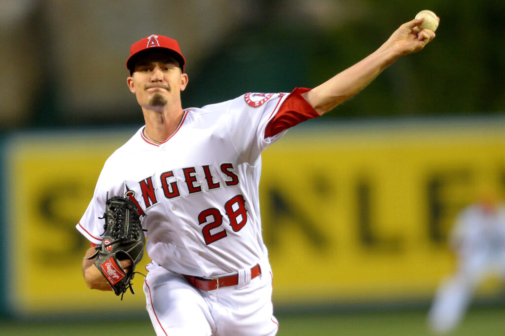 Andrew Heaney pitching for Angels in team uniform on mound baseball action wallpaper background