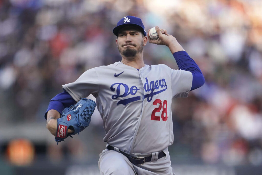 Dodgers pitcher Andrew Heaney mid-pitch showing focus and athleticism on the mound wallpaper