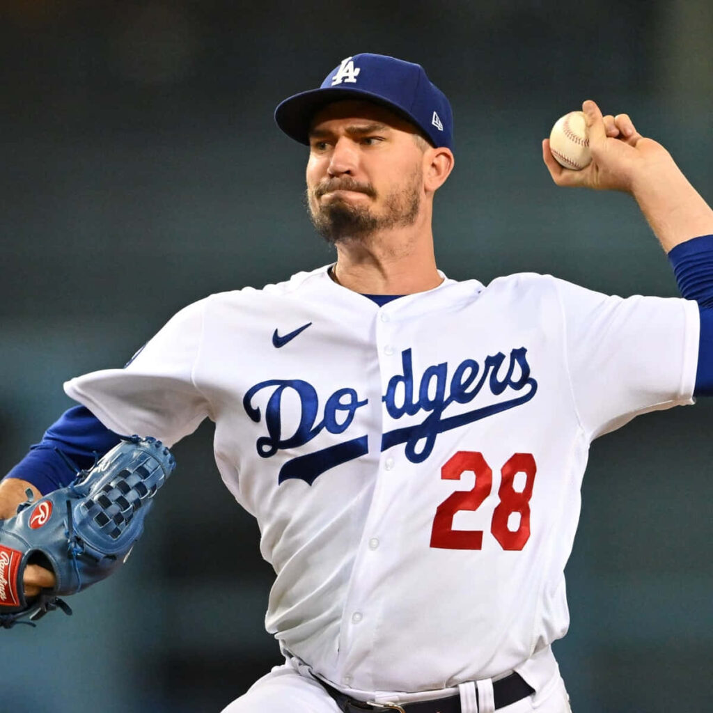 Dodgers pitcher Andrew Heaney mid-pitch intense focus dynamic baseball action wallpaper