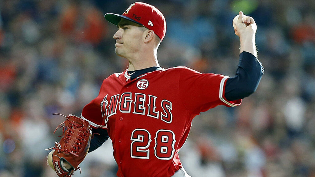 Andrew Heaney pitching with intense focus and athletic form on baseball field wallpaper background