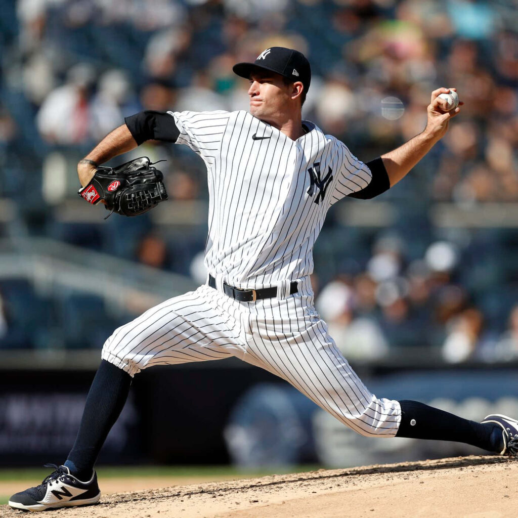 Andrew Heaney pitching in New York Yankees uniform showing athletic form and focus on mound Wallpaper