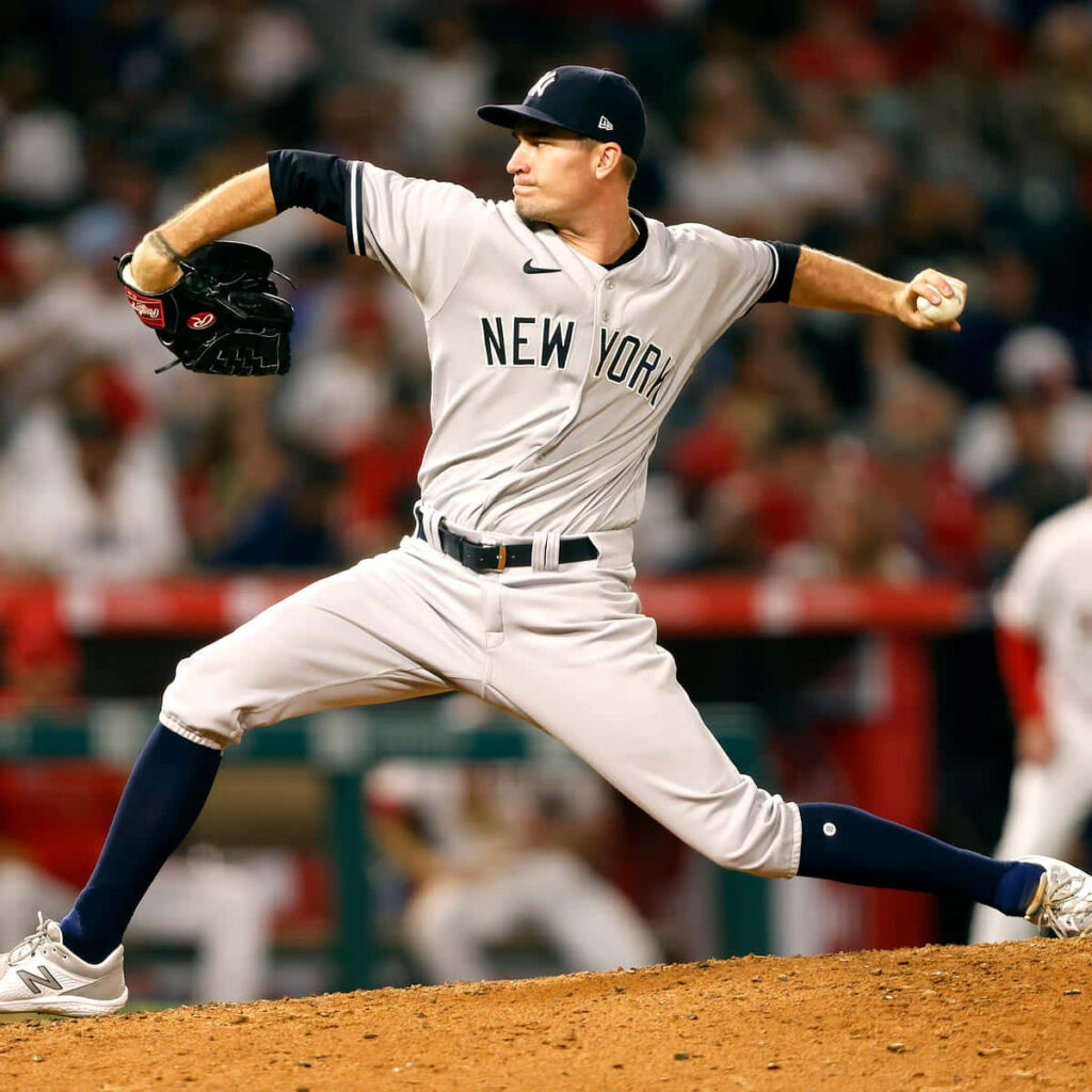 Andrew Heaney New York pitcher mid pitch baseball action intense focus athletic form wallpaper